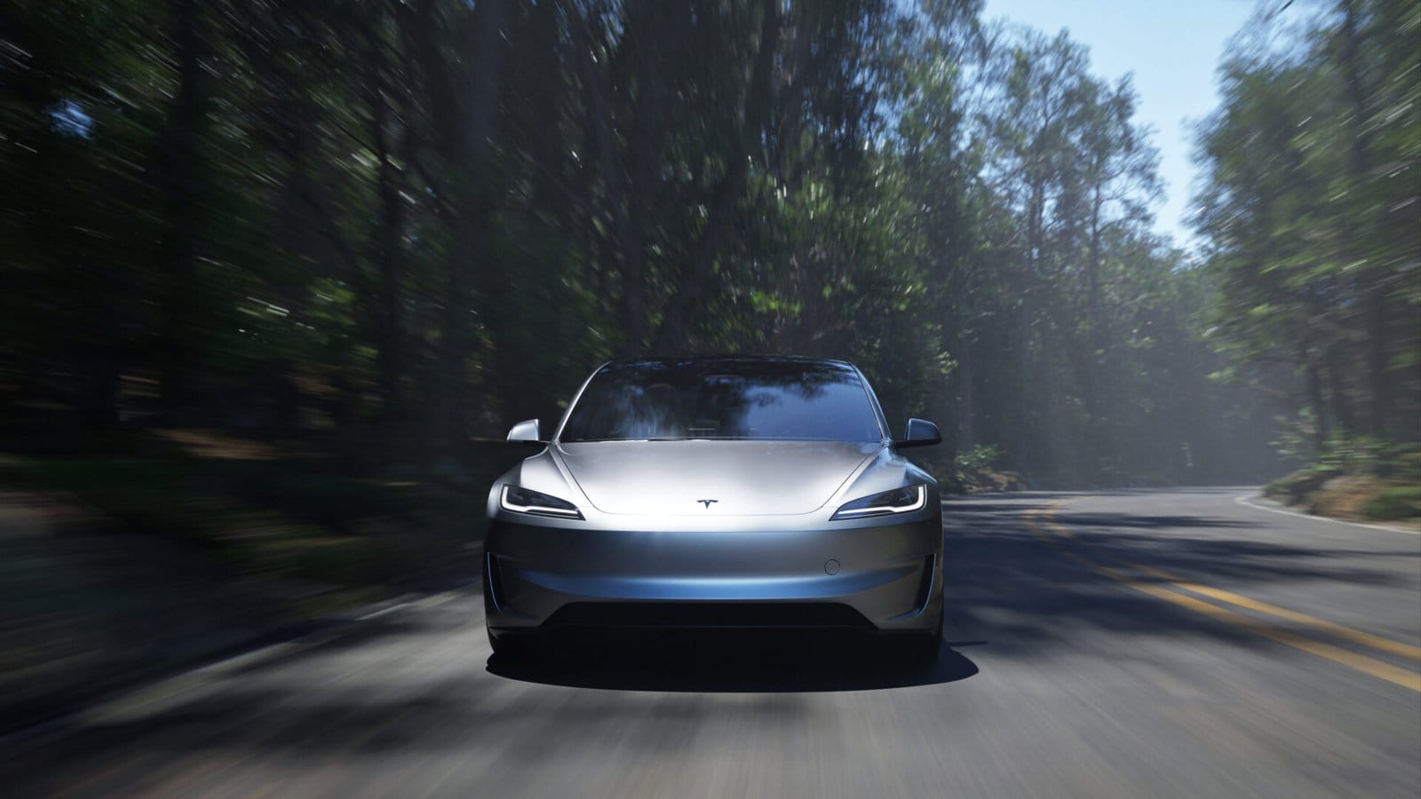 A Tesla Model 3 electric vehicle captured in motion on a winding road through a dense forest, with sunlight filtering through the trees.