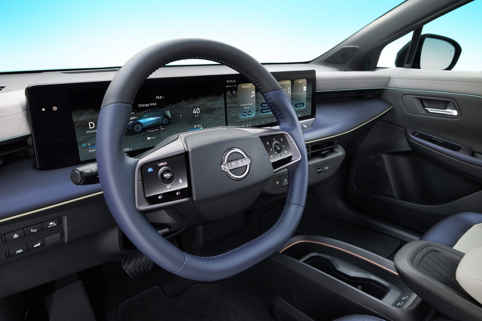 Close-up view of the Nissan Leaf electric vehicle’s steering wheel with digital display showing charging data