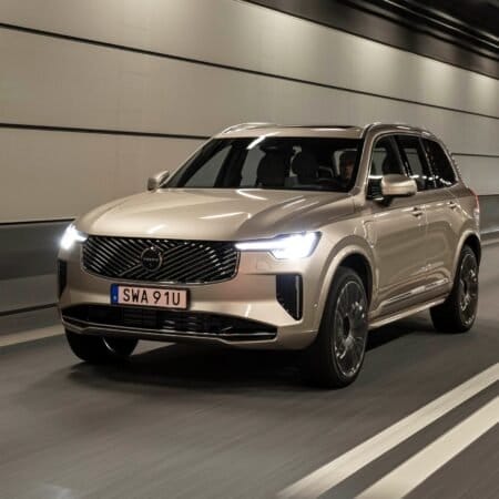 Volvo XC90 Recharge electric vehicle in motion inside a well-lit tunnel