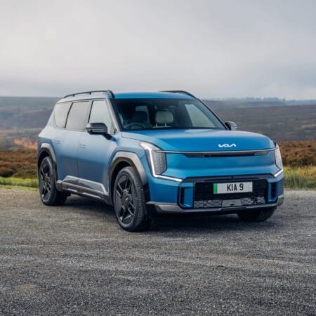 Azure Kia EV9 Electric Vehicle Against Wild Moorland
