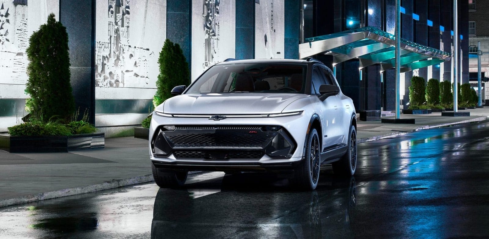 Chic White Chevrolet Equinox EV in Urban Night Scene