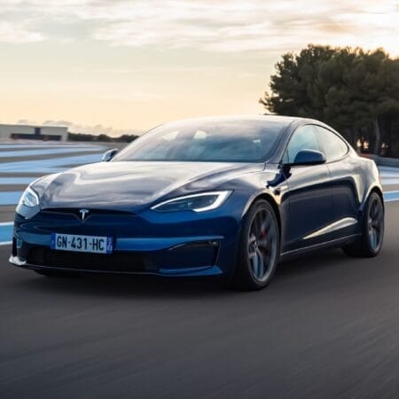 Sleek Blue Tesla Model S Electric Vehicle at Sunset