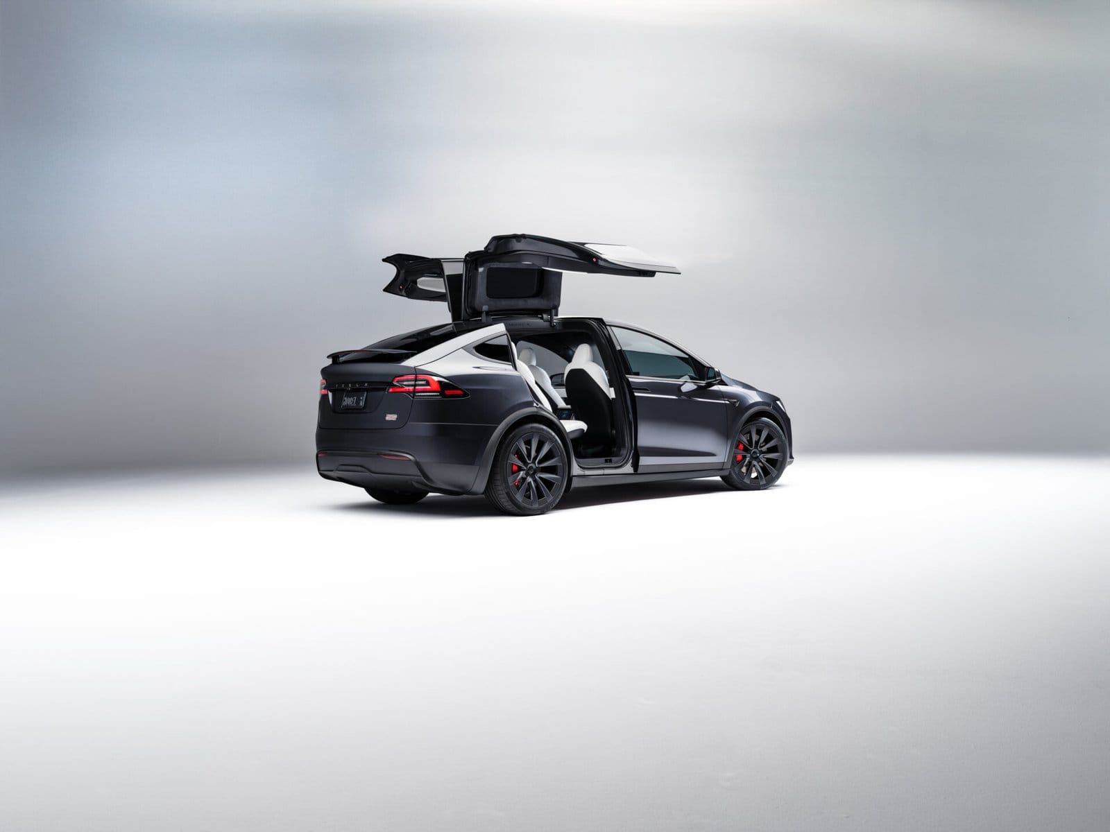 sleek black tesla model x electric vehicle