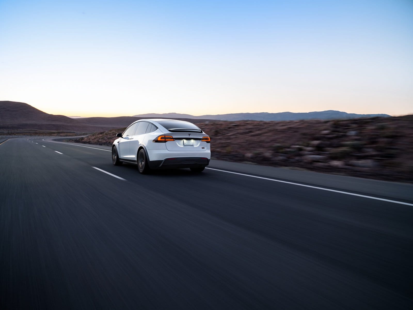 tesla model x electric vehicle dusk drive