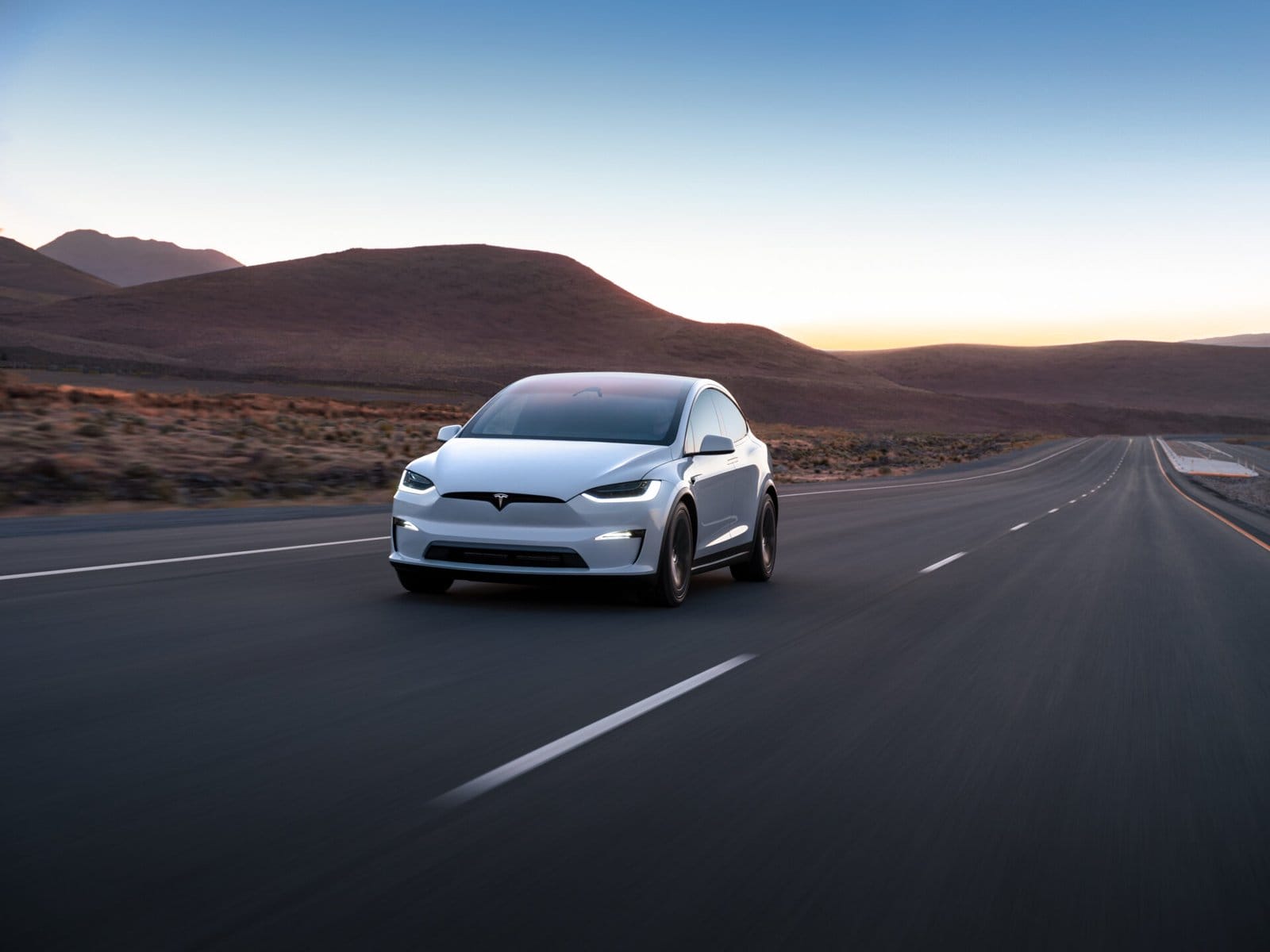 tesla model x electric vehicle on open road