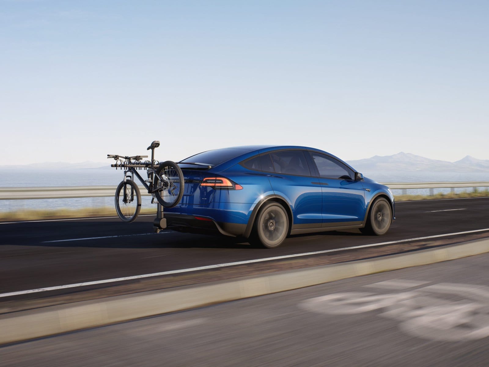 tesla model x electric vehicle with bike