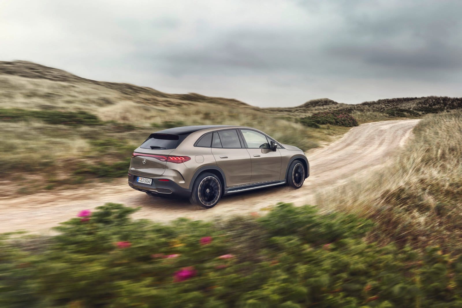 mercedes benz eqe suv electric vehicle dirt road