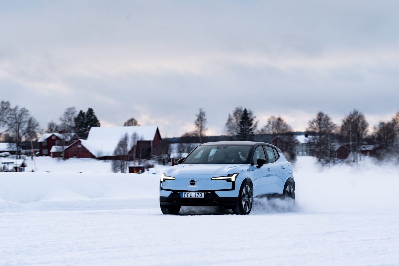 volvo ex30 electric vehicle snowy village drive