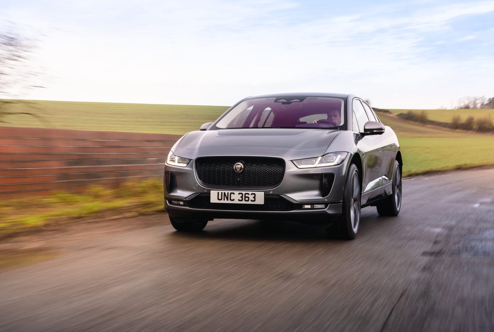 jaguar i pace electric vehicle driving country road