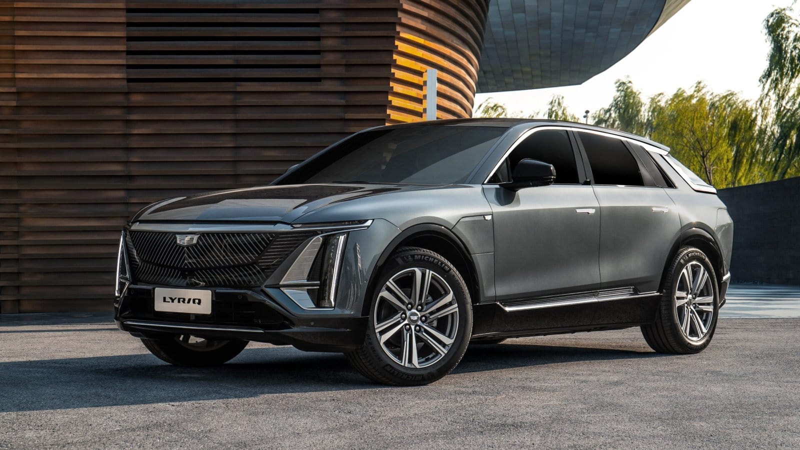 cadillac lyriq electric vehicle modern building exterior