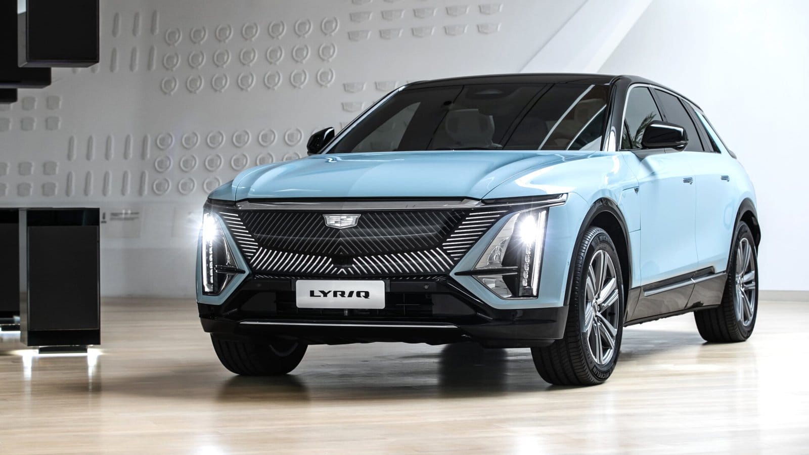 cadillac lyriq electric vehicle showroom blue