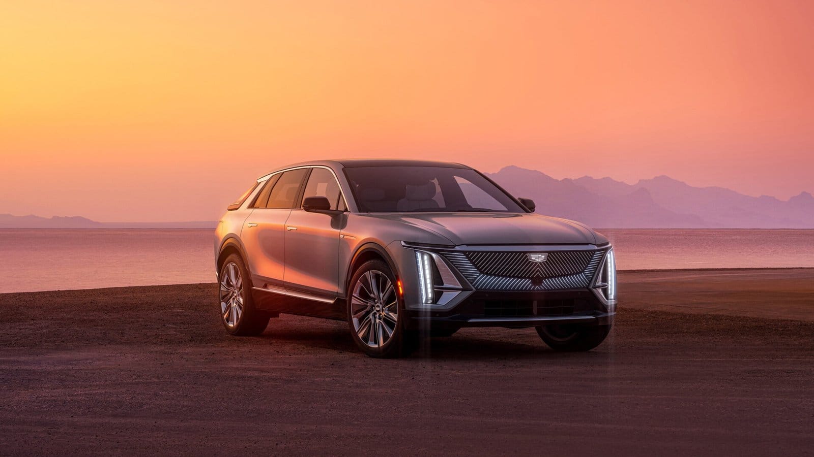 cadillac lyriq electric vehicle sunset mountain scenery