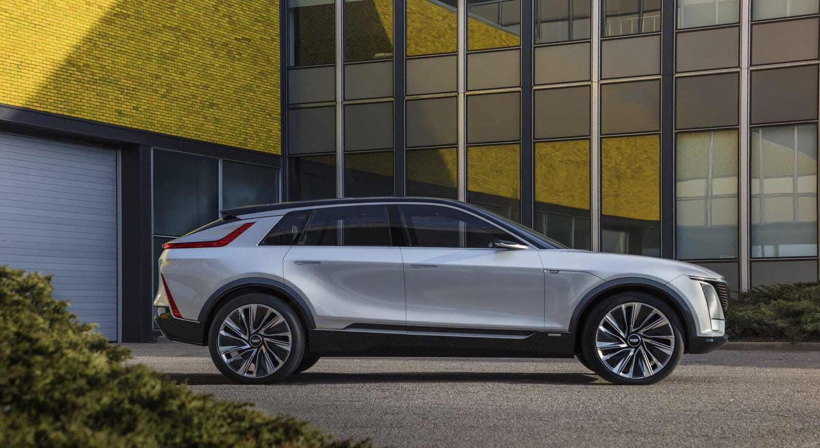 cadillac lyriq electric vehicle urban yellow building