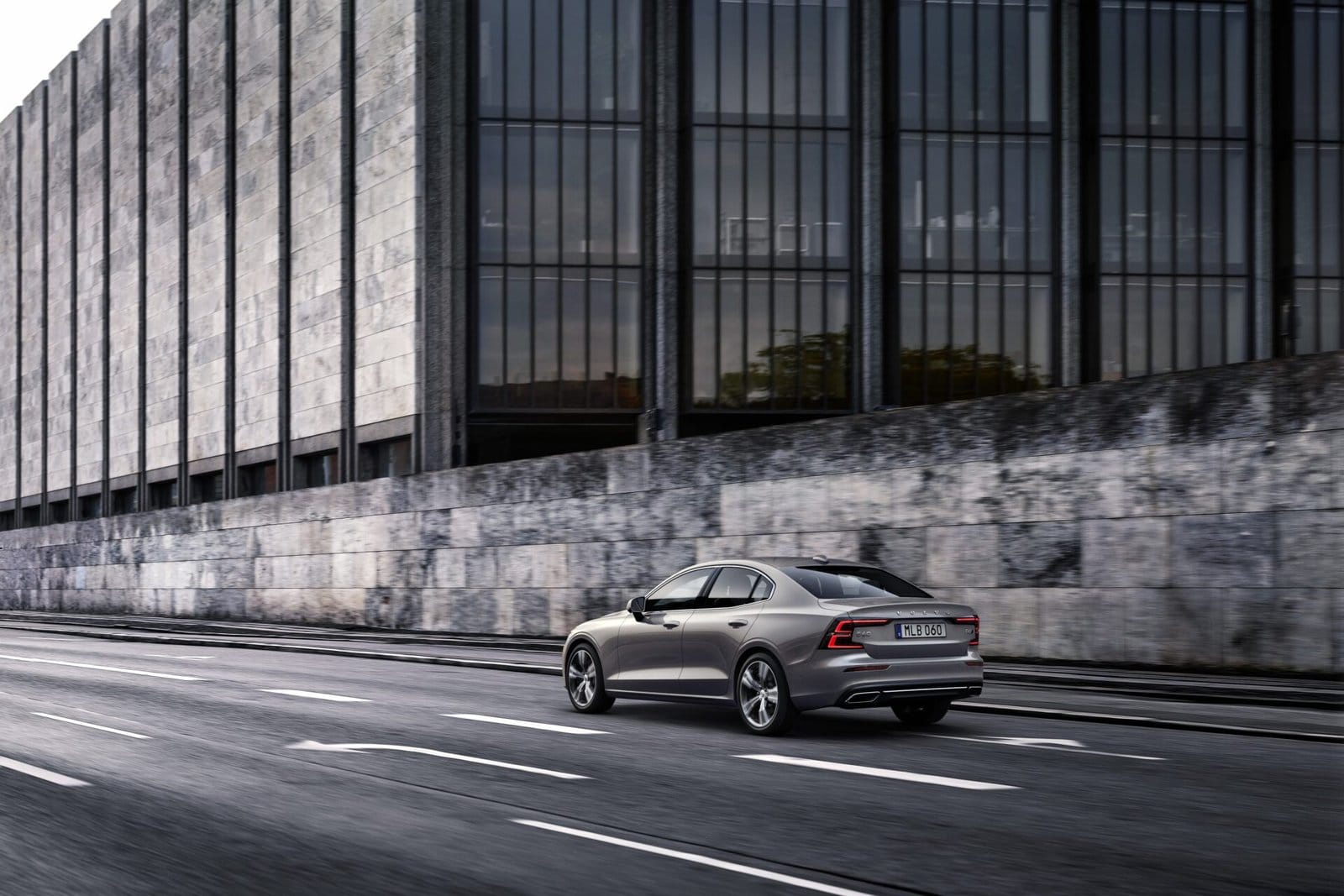 volvo s60 recharge electric vehicle city drive modern architecture