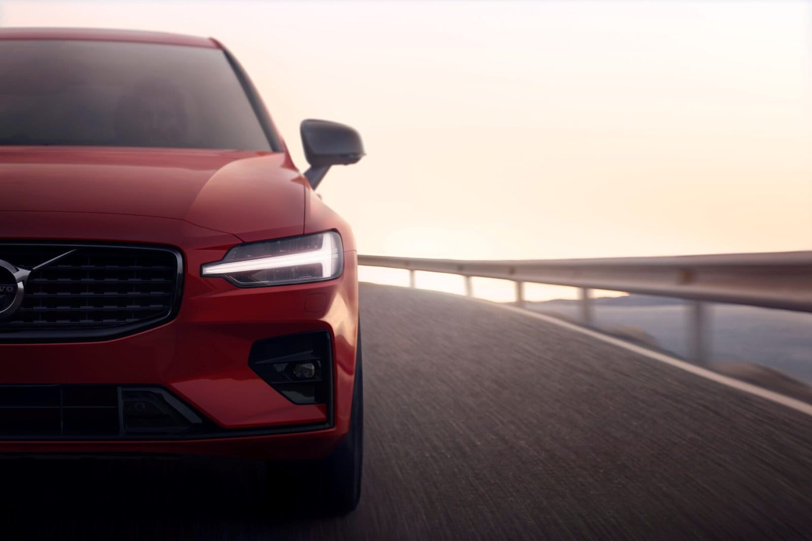 volvo s60 recharge electric vehicle curved road front view