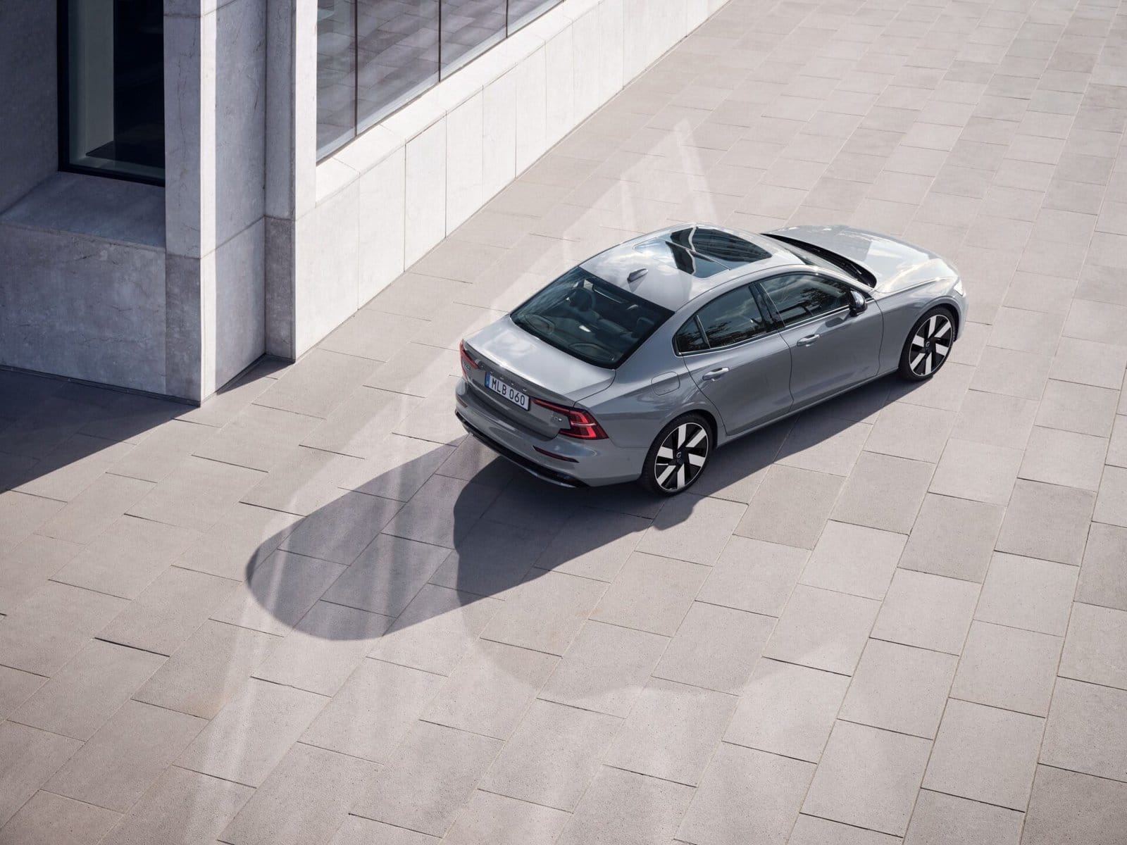 volvo s60 recharge electric vehicle rear view modern courtyard