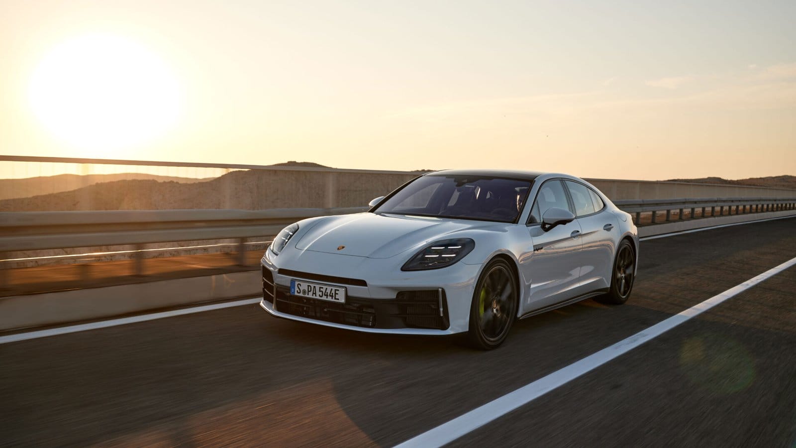 porsche panamera e hybrid electric vehicle at sunset