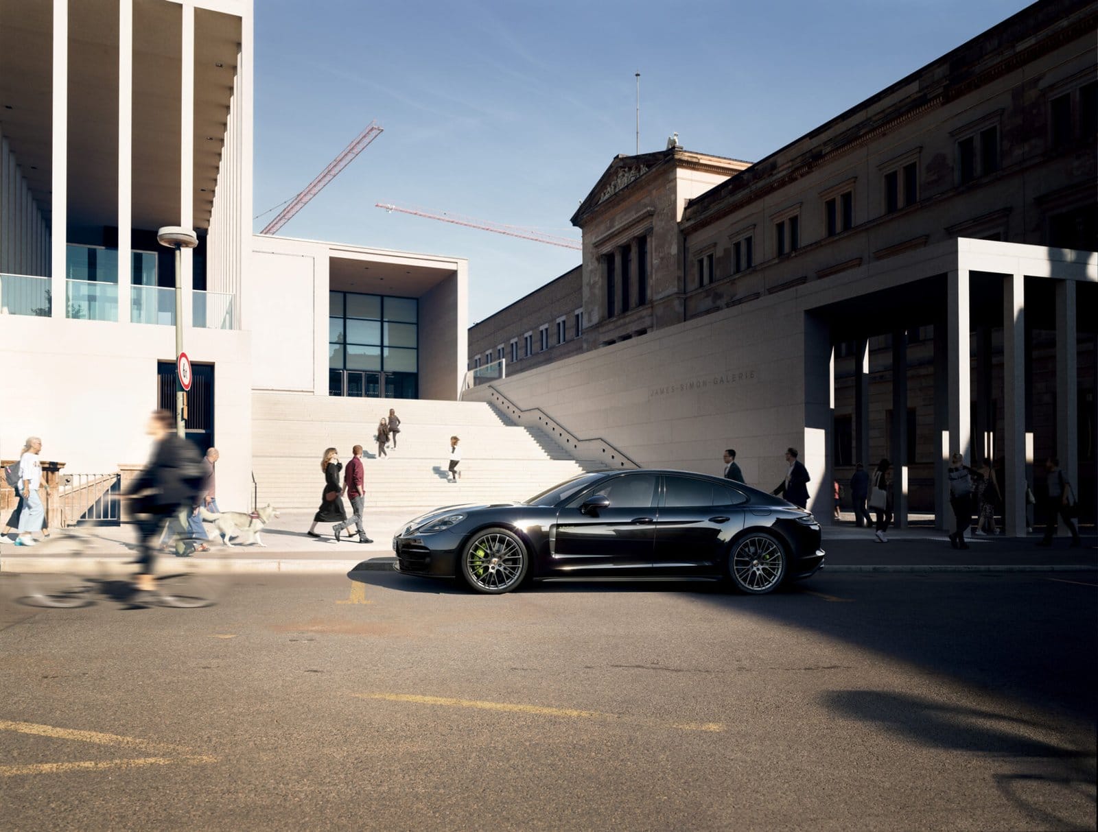 porsche panamera e hybrid electric vehicle city landscape.