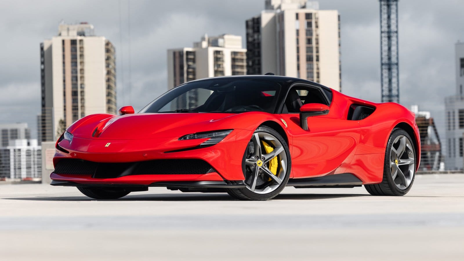 ferrari sf90 stradale electric vehicle cityscape