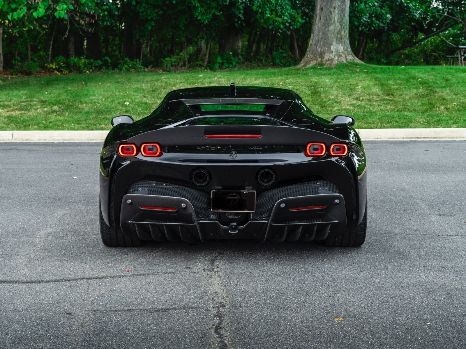 ferrari sf90 stradale electric vehicle rear black view
