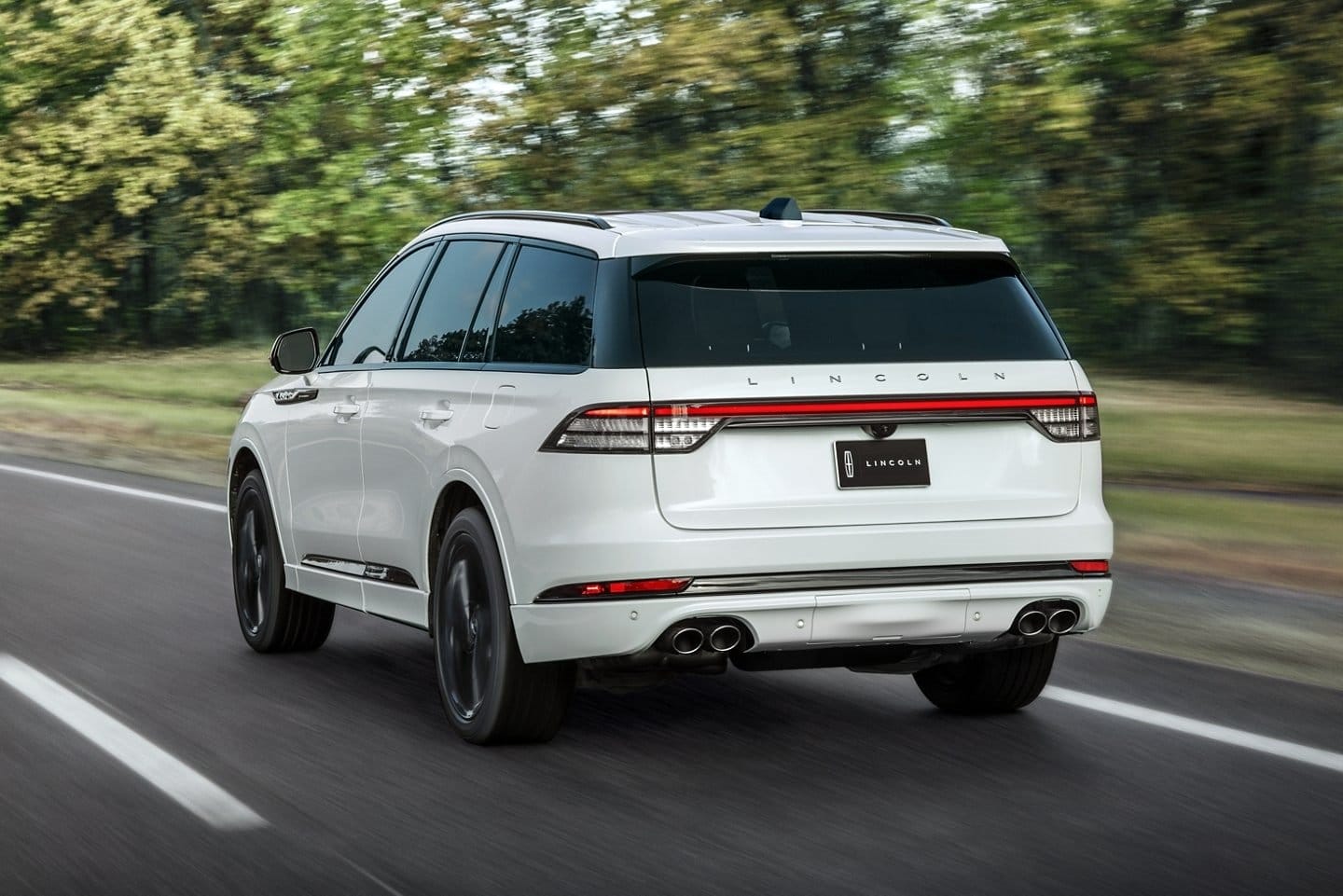 lincoln aviator grand touring electric vehicle rear motion road.
