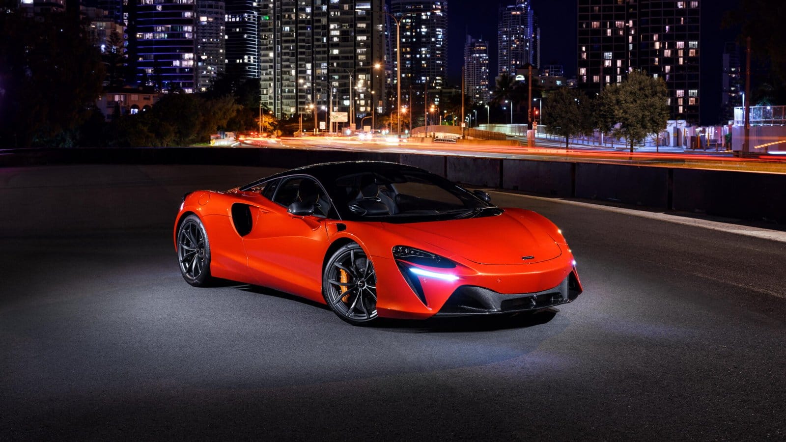 mclaren artura electric vehicle night city drive.