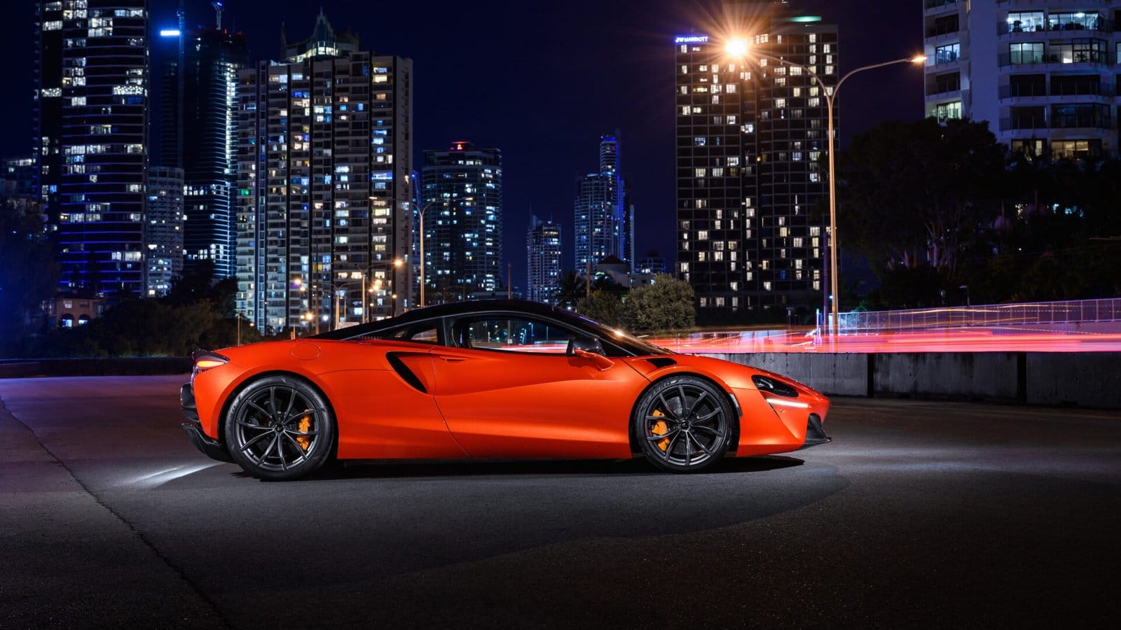 mclaren artura electric vehicle profile city night