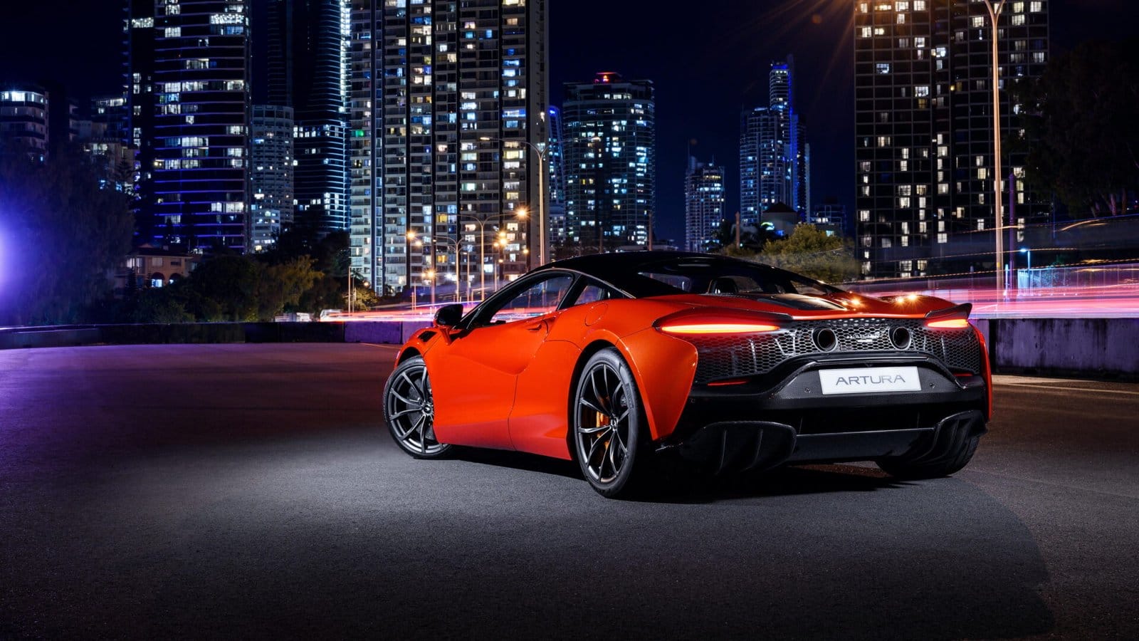 mclaren artura electric vehicle rear city lights.