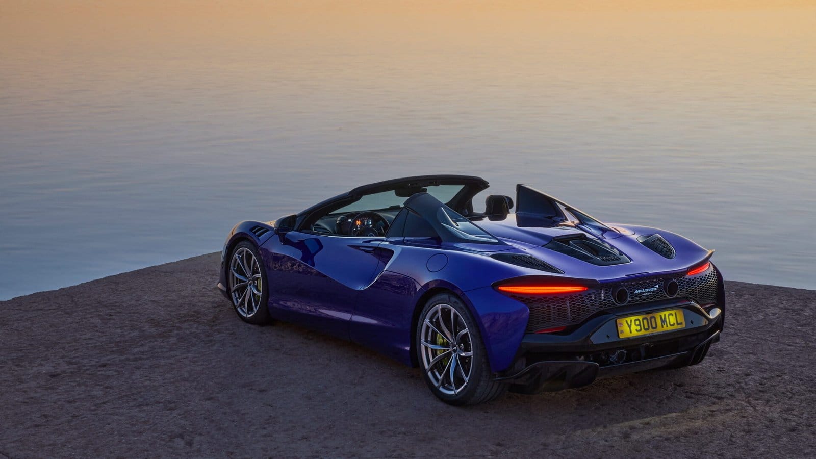 mclaren artura electric vehicle sunset lake