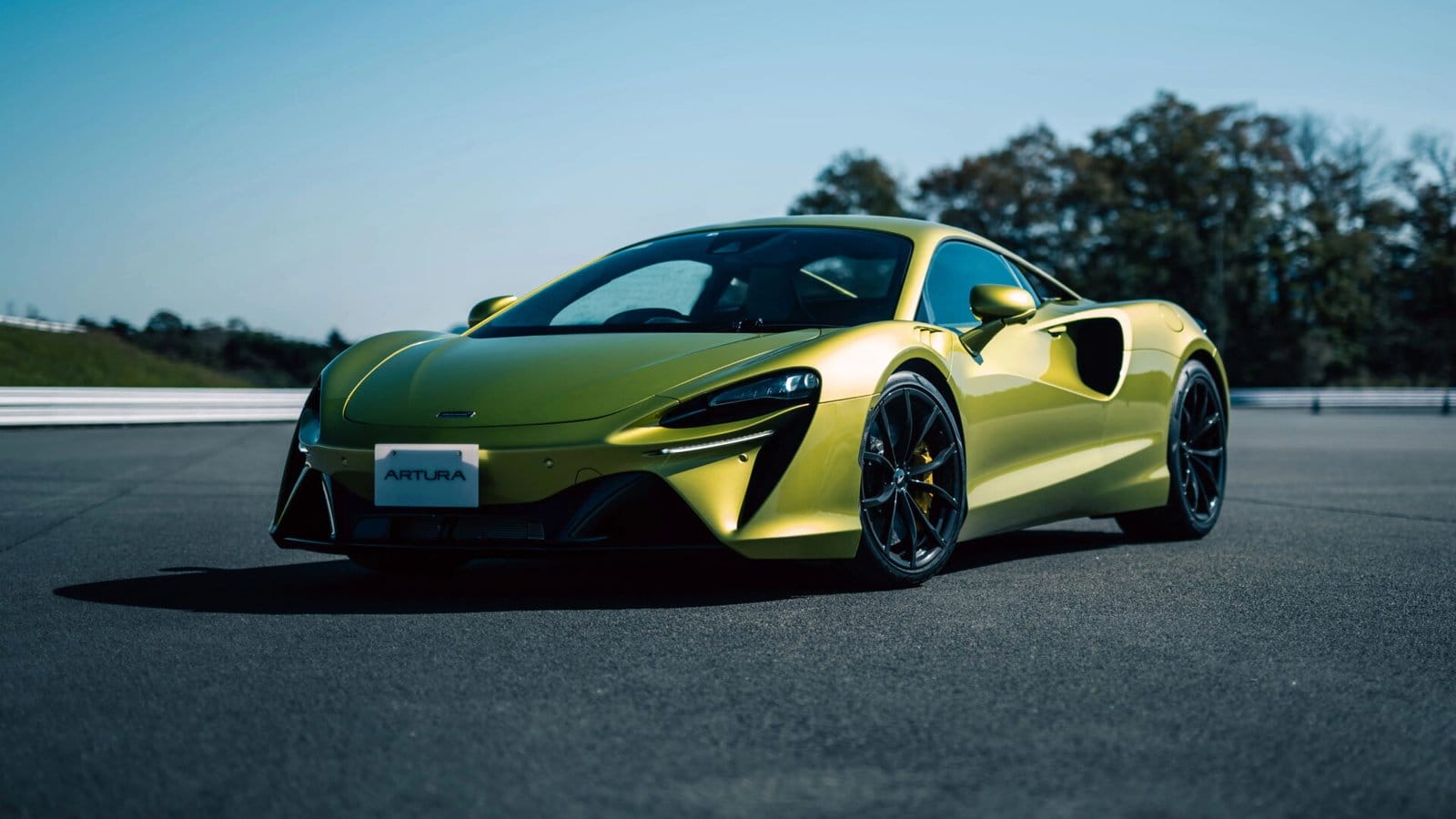 mclaren artura electric vehicle track view.