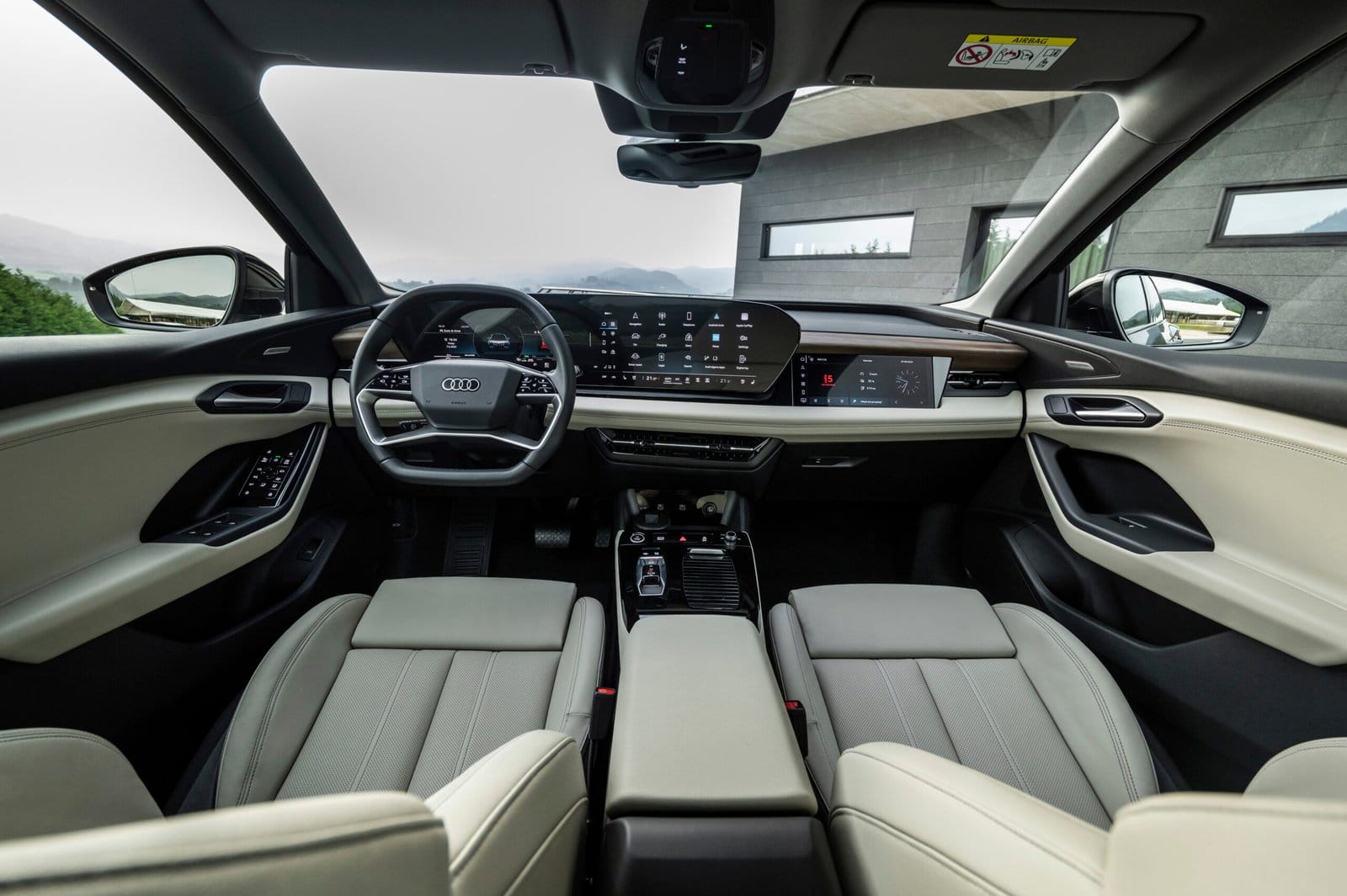 Interior front cabin of Audi Q6 electric vehicle featuring full dashboard and dual displays