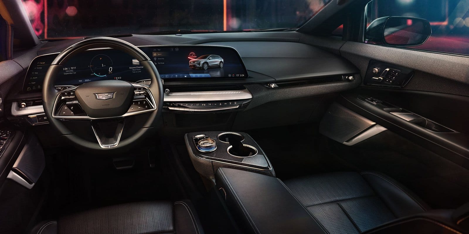 Driver’s cockpit of the 2025 Cadillac Optiq electric vehicle featuring a curved digital display and modern steering wheel