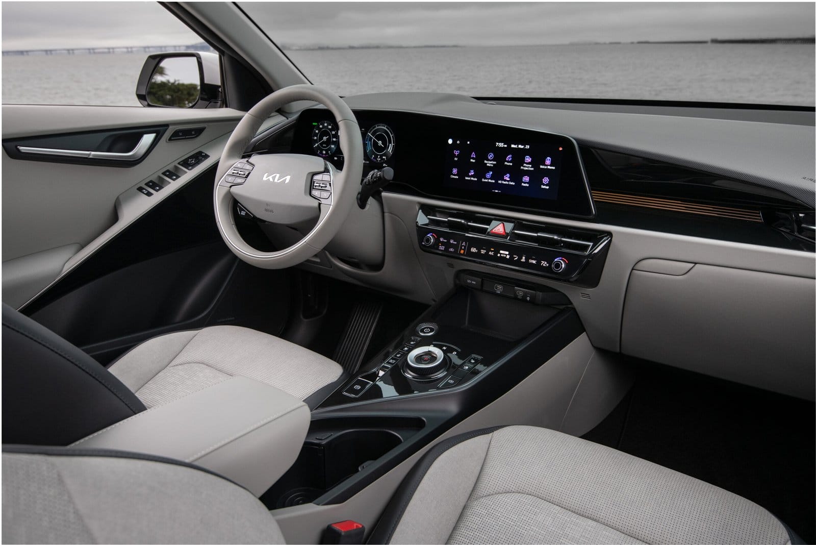 Interior of the Kia Niro EV electric vehicle featuring steering wheel, digital gauge cluster, and center touchscreen