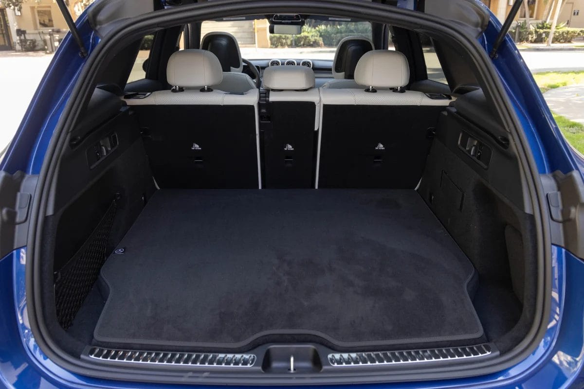 Open trunk view of the Mercedes-Benz GLC PHEV electric vehicle showing the rear seats and carpeted cargo floor