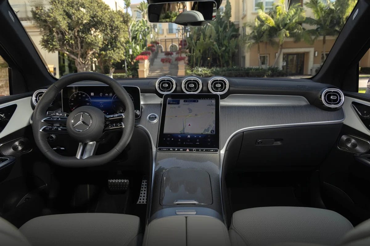 Interior view of the Mercedes-Benz GLC PHEV electric vehicle showing the digital cockpit, infotainment screen, and dashboard vents