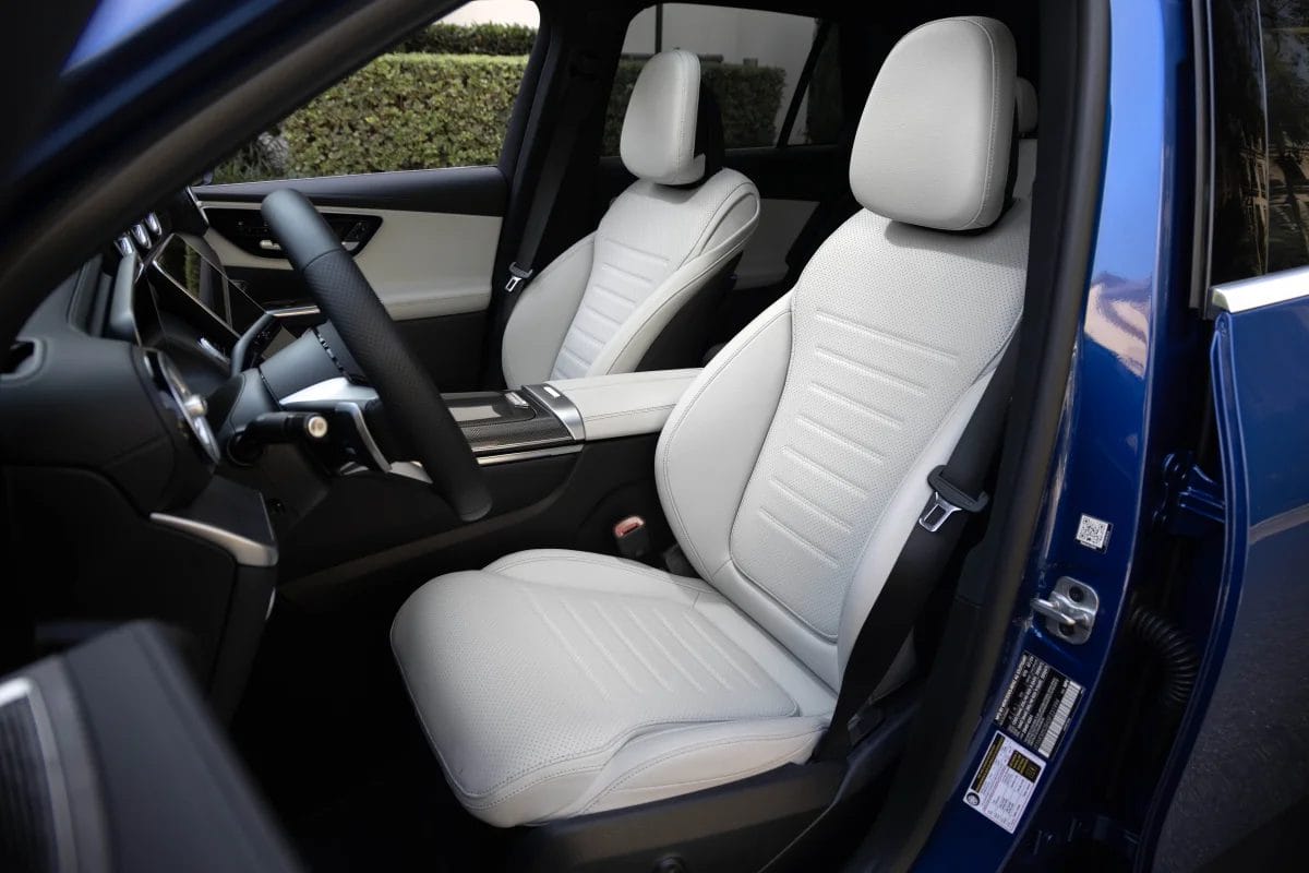 Close-up view of the front seats in the Mercedes-Benz GLC PHEV electric vehicle with light upholstery and modern cabin styling