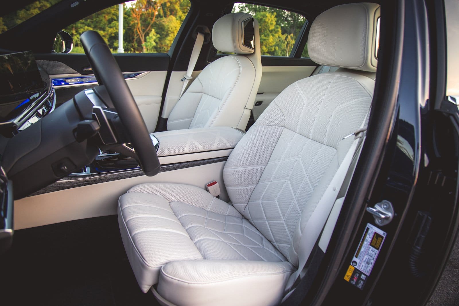 White leather front seats and cabin of BMW 750e xDrive Plug-in Hybrid