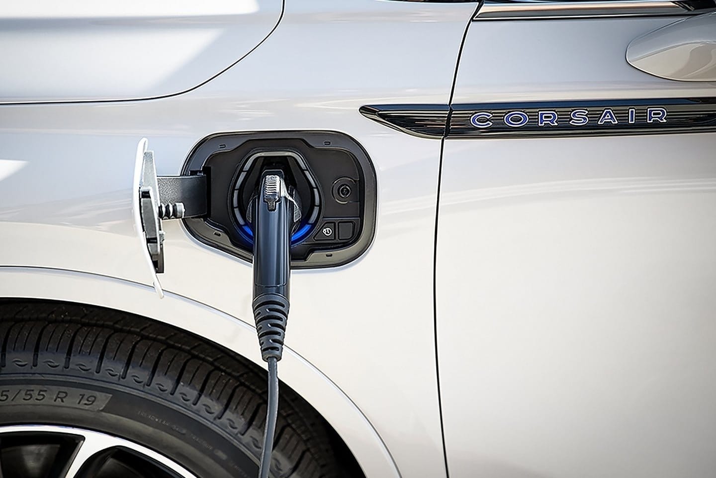 Plug-in charging cable connected to the Lincoln Corsair Grand Touring plug-in hybrid near rear wheel