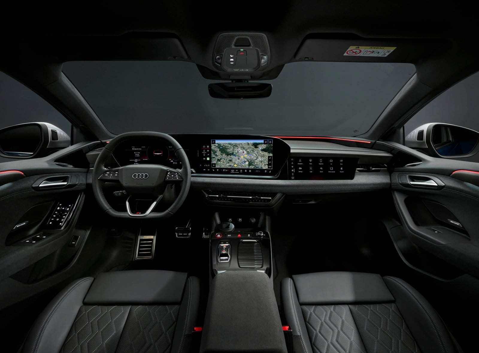 Front interior view of Audi S6 e-tron electric vehicle showing steering wheel, infotainment screen, and driver display.