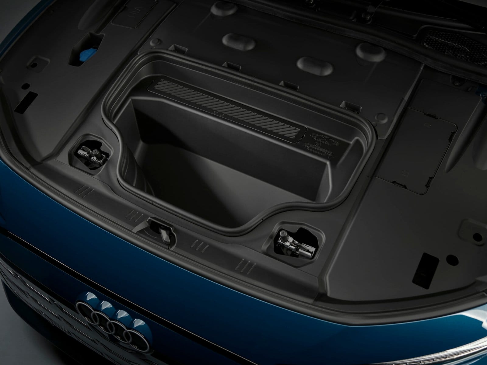 Front trunk storage compartment of Audi S6 e-tron electric vehicle with open lid.