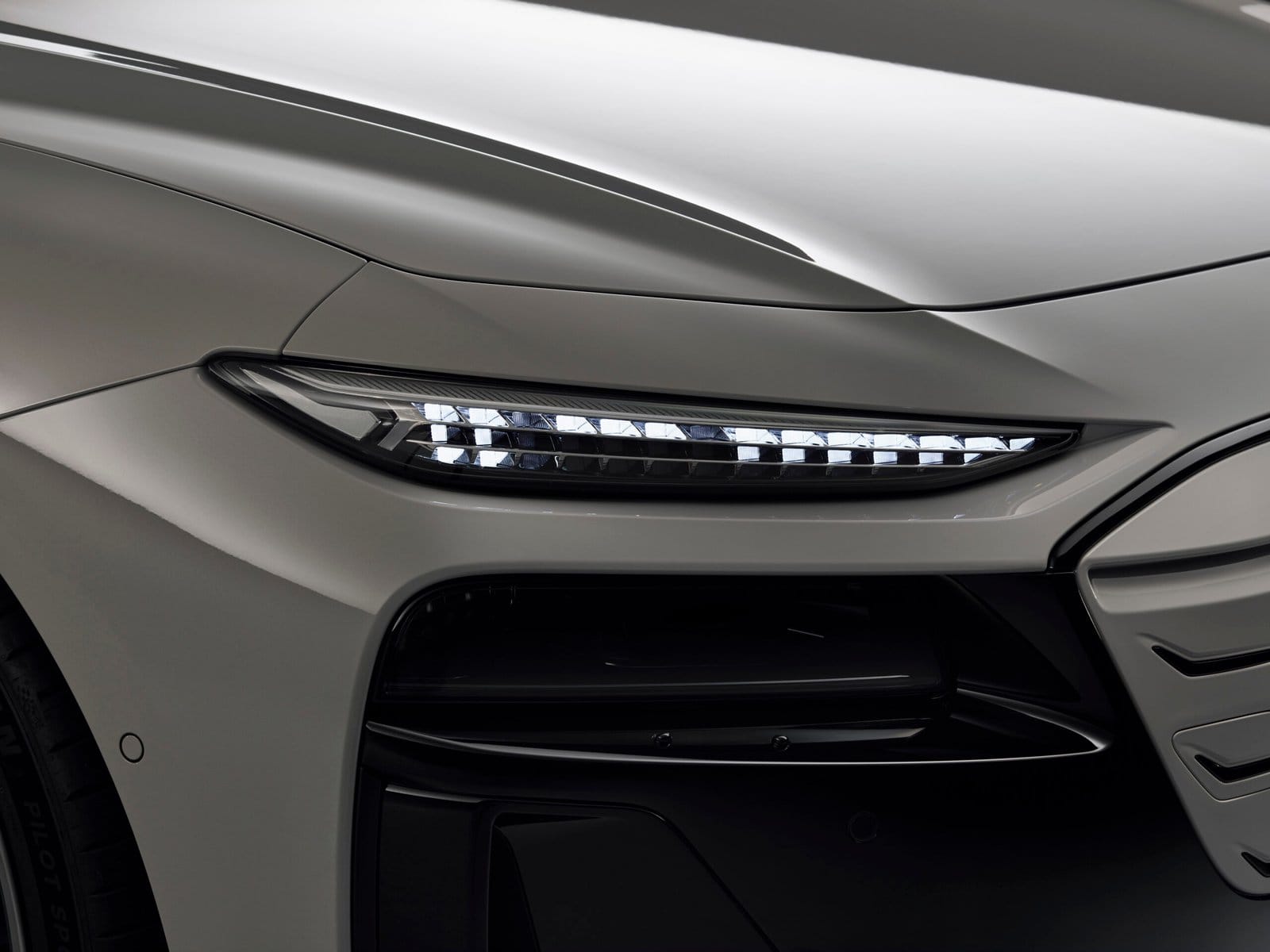 Close-up view of the 2025 Audi A6 e-tron electric vehicle LED headlight design