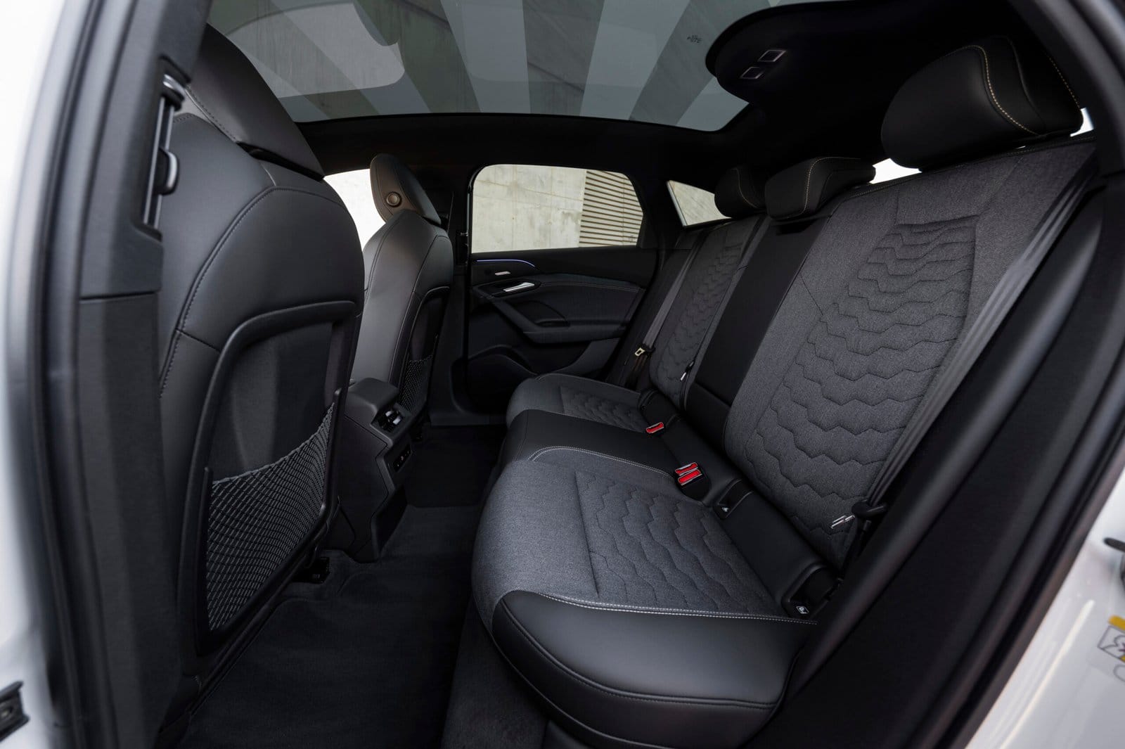 Interior rear seats of Audi A6 e-tron electric vehicle with fabric and leather finish