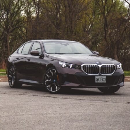Front exterior view of BMW 550e xDrive electric vehicle parked outdoors