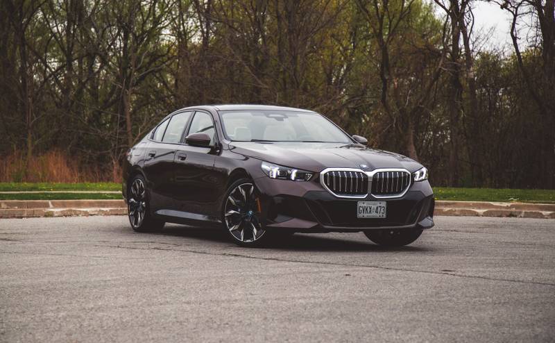 Front exterior view of BMW 550e xDrive electric vehicle parked outdoors