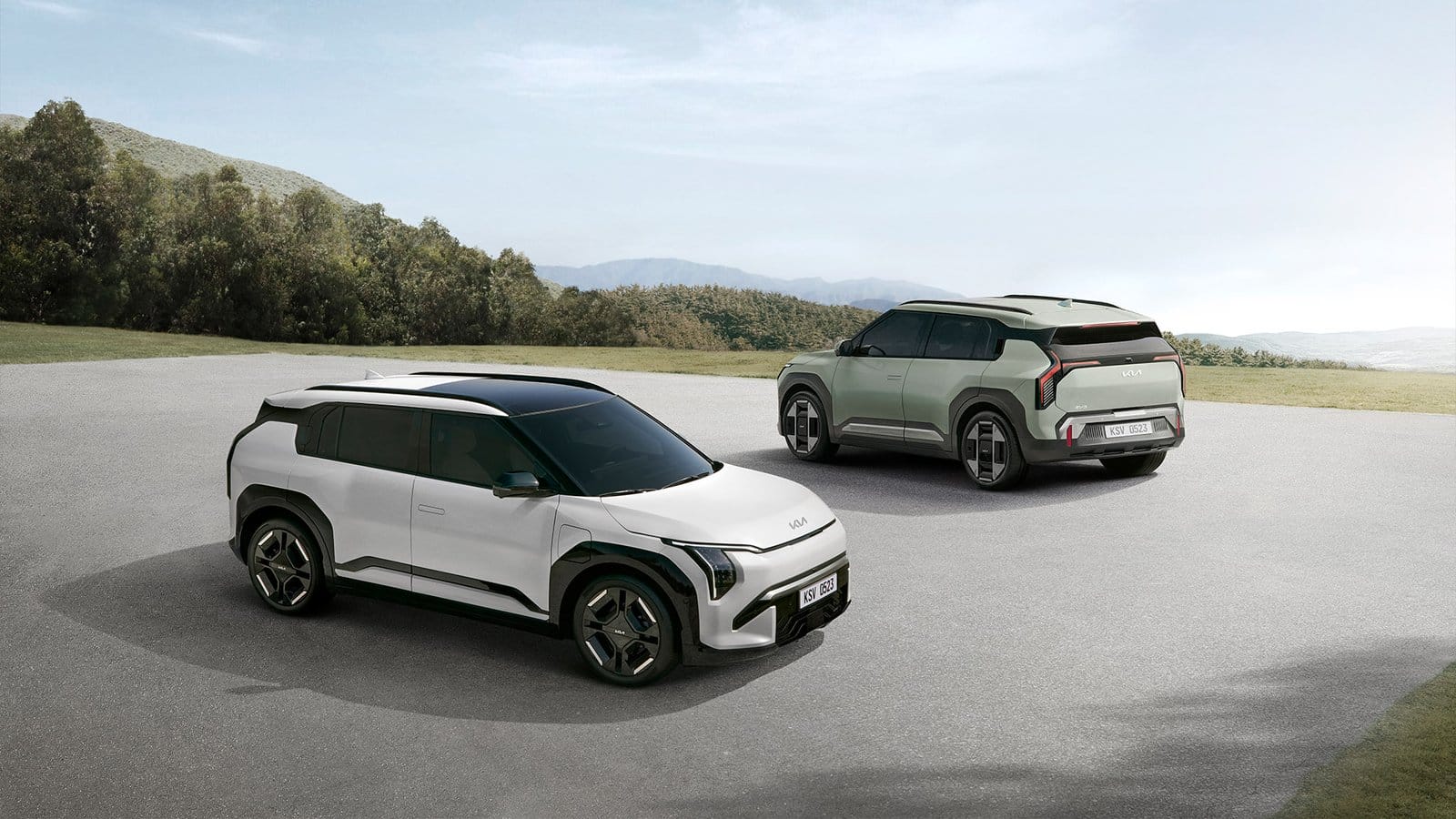 Two Kia EV3 electric vehicles parked outdoors, front and rear angles visible